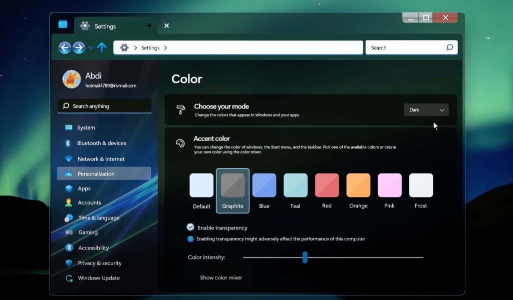 Windows 11 Settings app dark mode showing Personalization Colors menu with accent options Graphite Frost Wallpaper