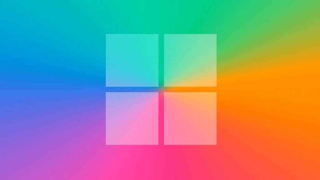 Minimalist Windows 11 logo centered on vibrant blurred rainbow gradient wallpaper background