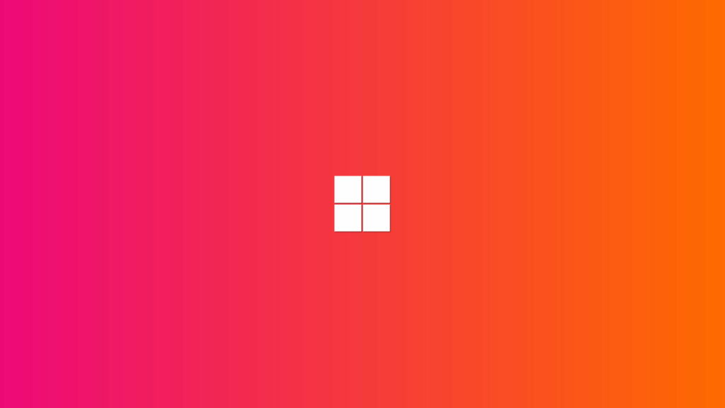 Vibrant Windows 11 Bliss: A Captivating 4K Wallpaper Featuring the Pink and Orange Microsoft Logo on a Striking Background
