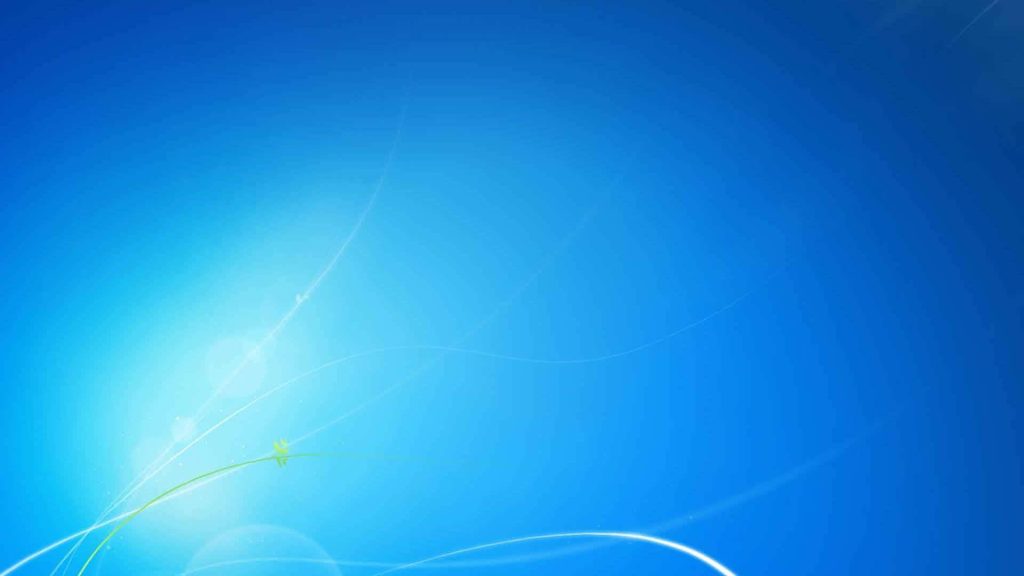 Windows 7 default wallpaper blue gradient with flowing white light curves and soft lens flare