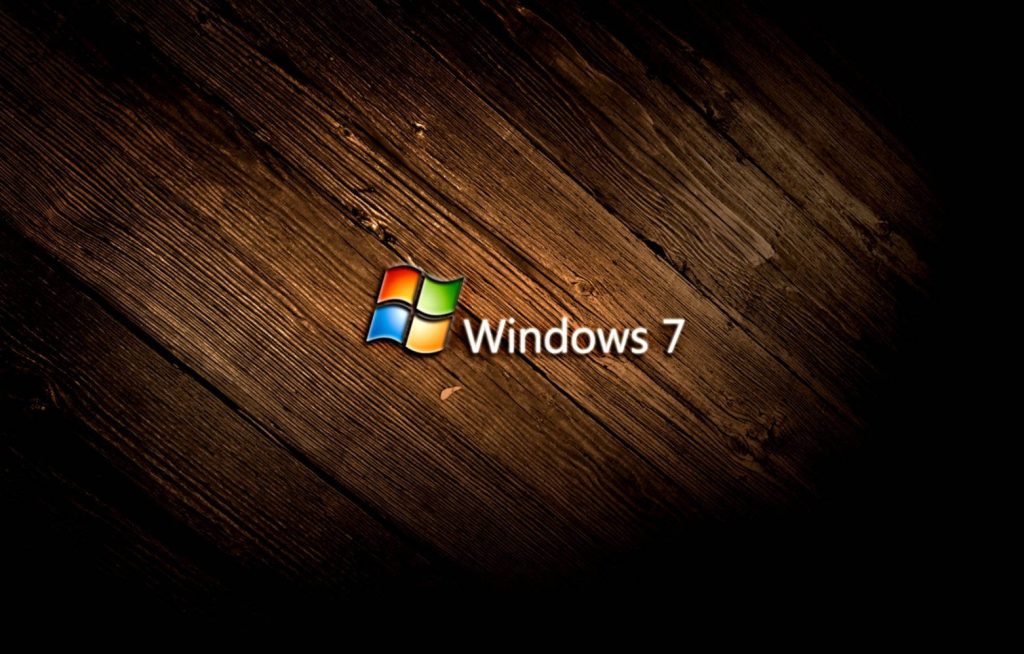 Windows 7 logo on rustic dark wooden planks background with moody lighting high-definition wallpaper