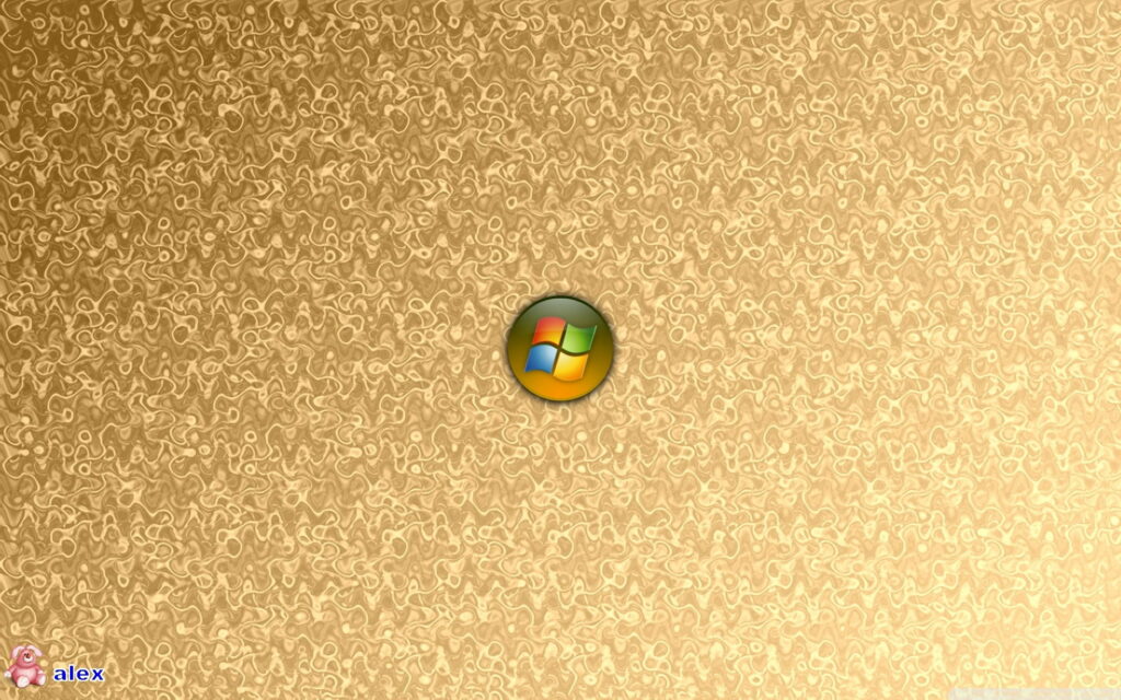 High-definition desktop wallpaper with 3D Windows orb on shimmering liquid gold background