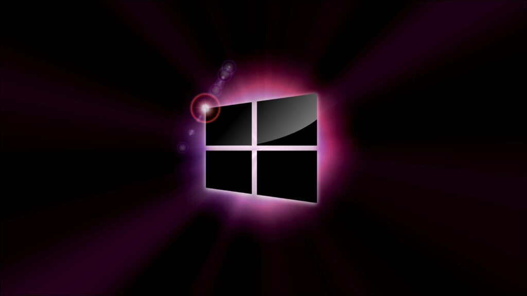 Elegant Contrast: Windows 8 Shines Through Darkness in Radiant Purple Backlight Wallpaper