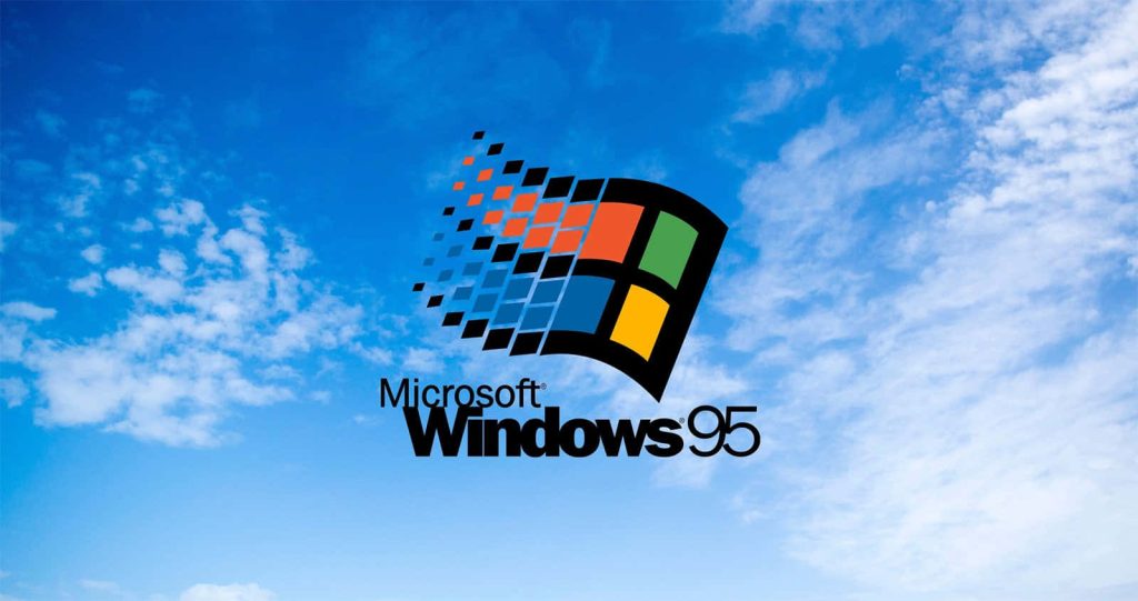 Windows 95 iconic colorful waving flag logo with bright blue sky and clouds retro wallpaper background