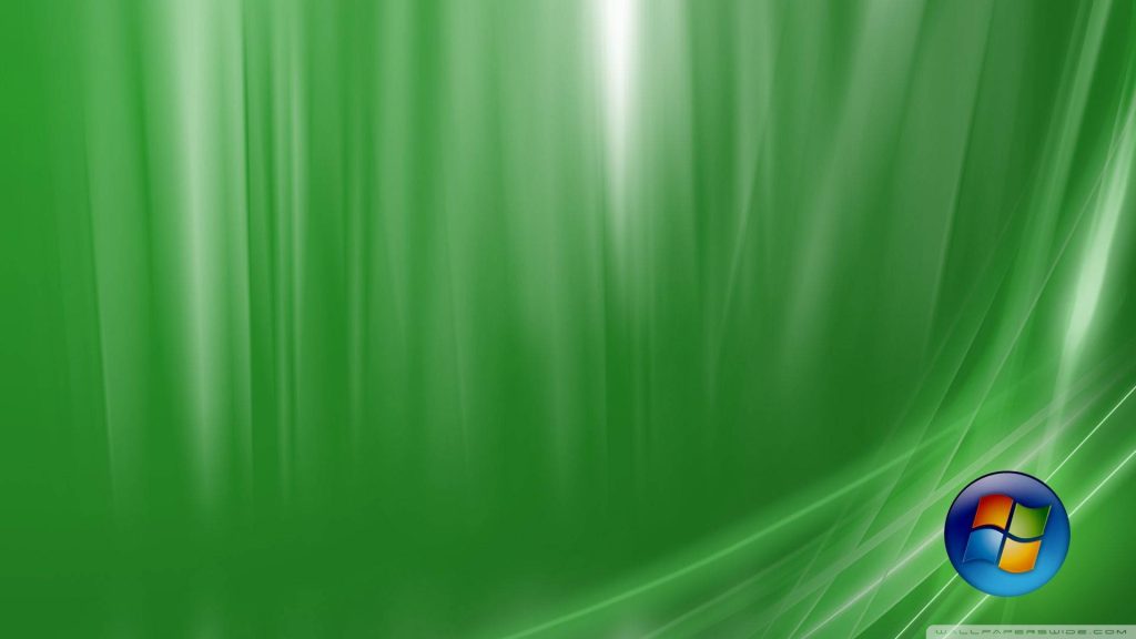 Windows Vista Aurora wallpaper with flowing green curves glowing light streaks and Windows orb logo