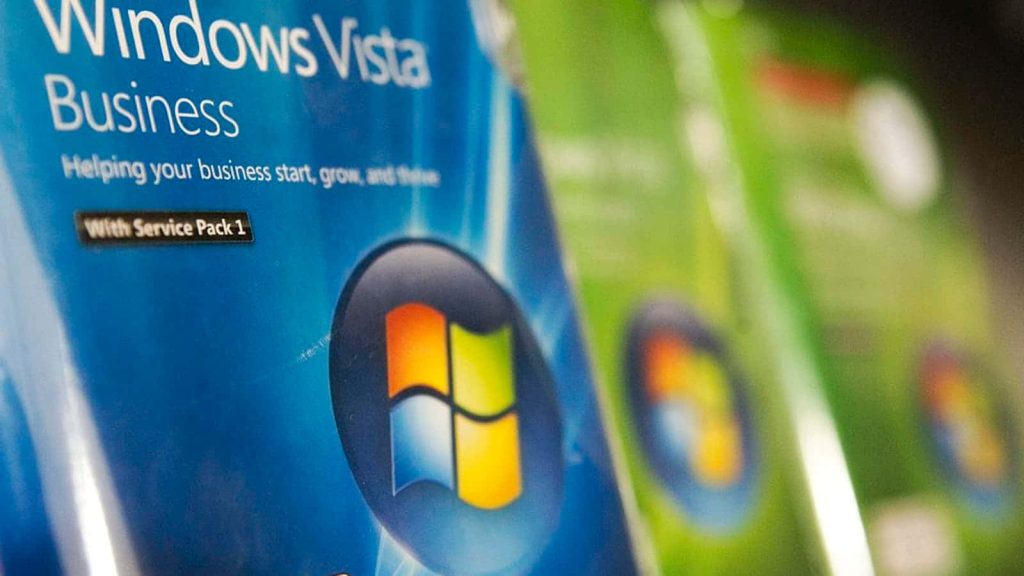 Close-up of Windows Vista Business packaging with logo and Service Pack 1 on blue green background Wallpaper
