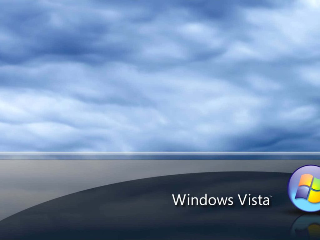 Windows Vista wallpaper with cloudy blue sky wavy horizon and signature reflective logo background