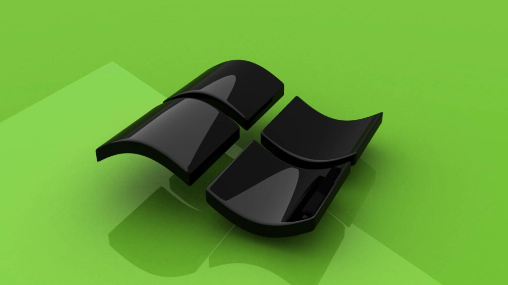 Technological Elegance: The Futuristic Allure of a Black Windows Logo on a Green, Glossy Table Wallpaper