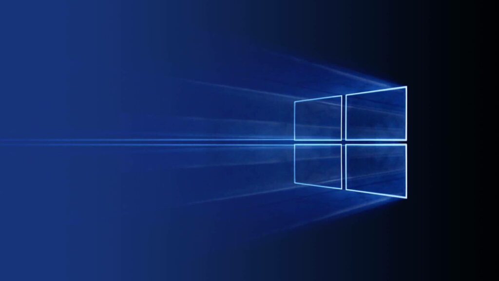 Gleaming Symbol of Technological Brilliance: Microsoft's Illuminated Windows Logo Sparks A Bright Future Wallpaper