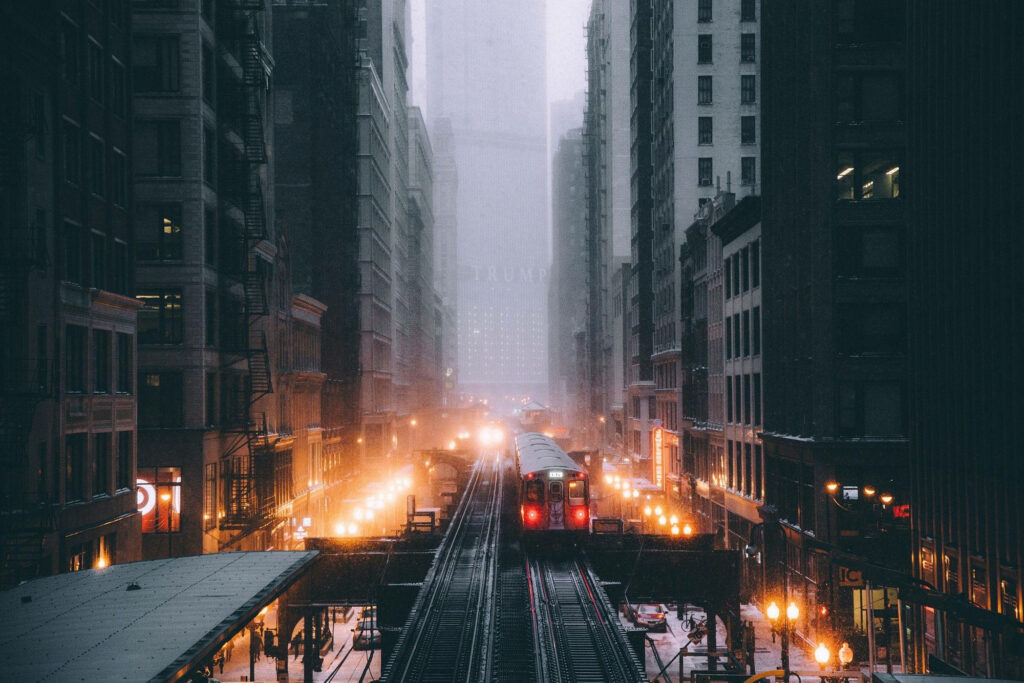 Wintery Chicago Metro Subway at dusk with snowy elevated tracks and glowing streetlights Wallpaper