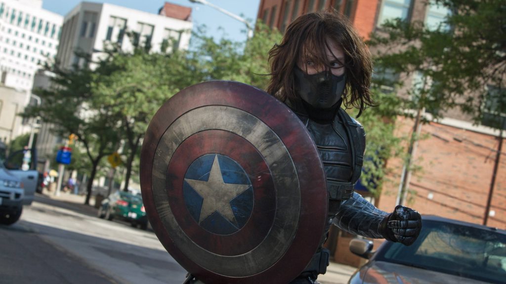 Winter Soldier in tactical gear wielding Captain America shield urban street Marvel wallpaper