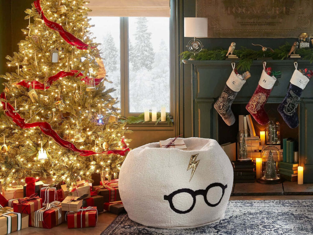 Winter Wonderland: Hogwarts Castle Glows with Festive Charm on a Snowy Christmas Night Wallpaper
