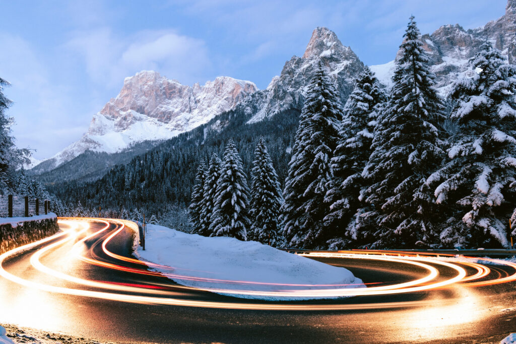 Winter Wonderland: Time-Lapse Journey through Majestic Mountain Scenery with Vehicles, perfect for a Refreshing iPad Background Wallpaper