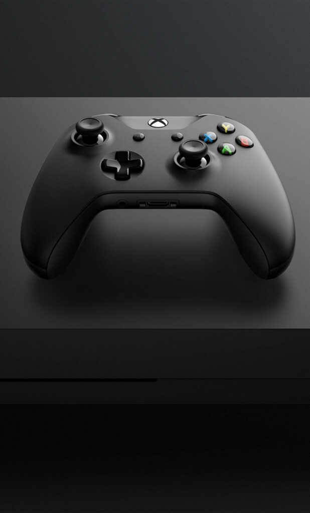 Dark and Sleek: A Wireless Xbox Controller Takes Center Stage on a Tabletop Wallpaper