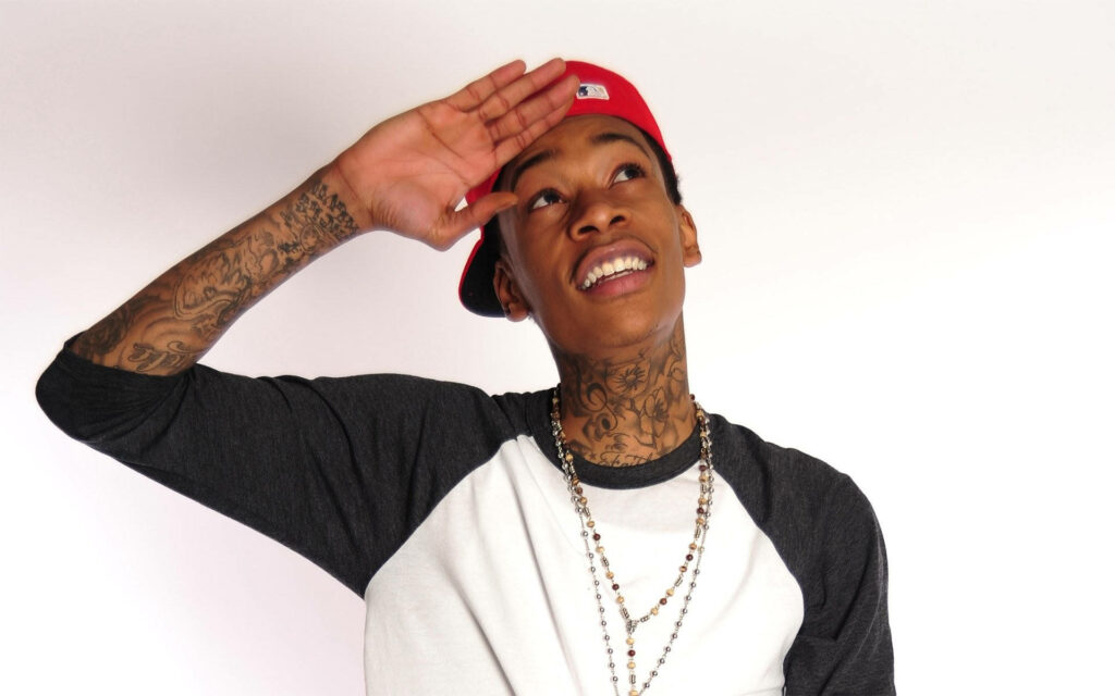 Wiz Khalifa Cheerful Pose Wallpaper: Red Cap, Gold Chains & Tattoos