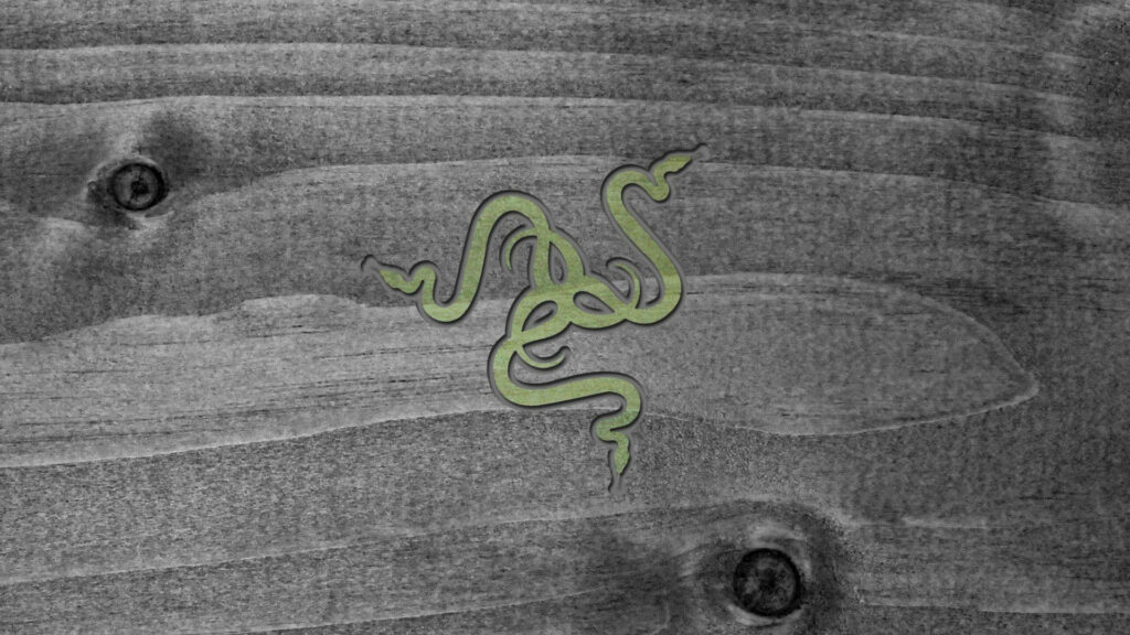 Monochromatic Beauty: Razer PC Logo Embedded on Wood Grains Wallpaper