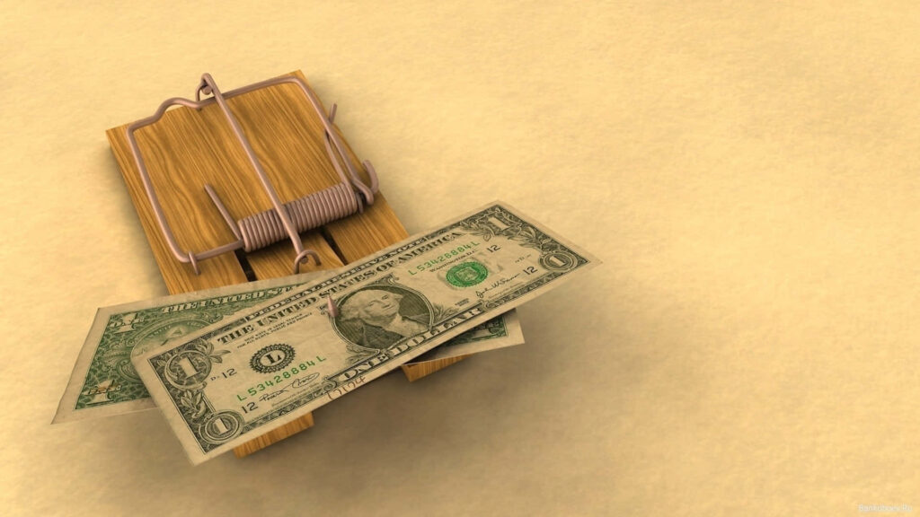 Wooden mousetrap with one dollar bills bait symbolizing financial risks and money dangers wallpaper