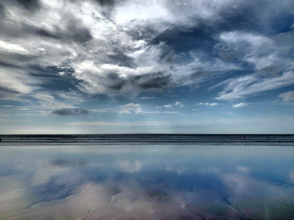 Serene Woolacombe Beach Wallpaper: Dramatic Sky & Tranquil Reflections