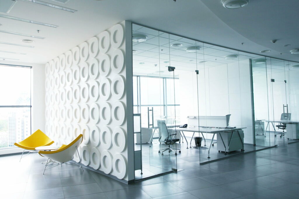 Efficient Workspaces: A Vibrant Interior Setting for Productive Offices Wallpaper