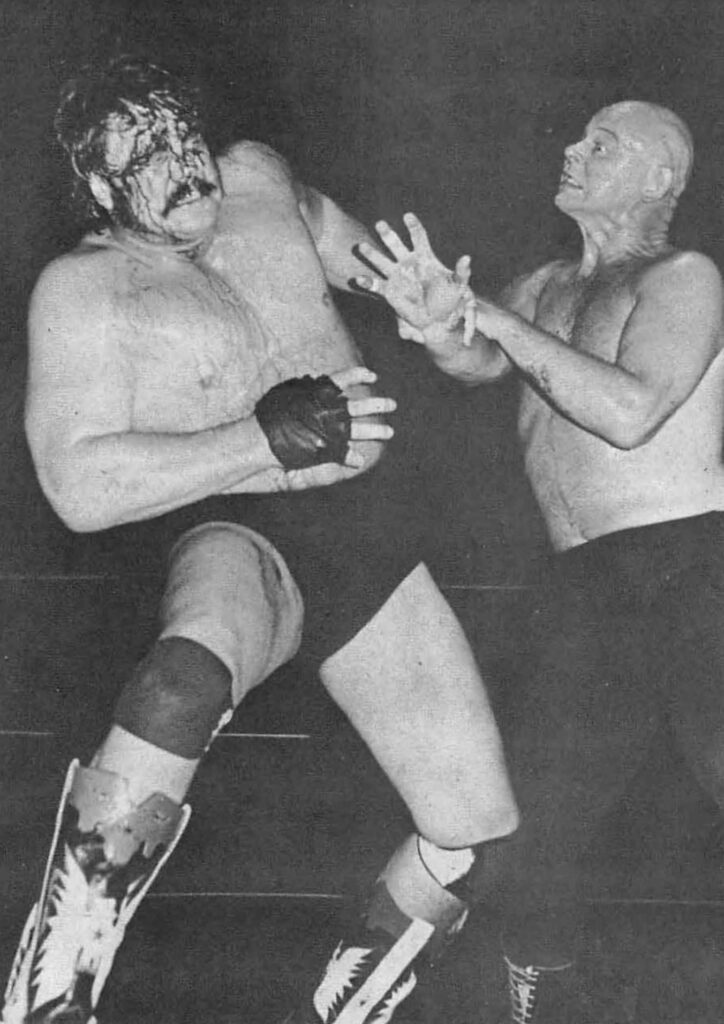 Wrestling legends Blackjack Mulligan and Baron Von Raschke intense ring clash wallpaper background