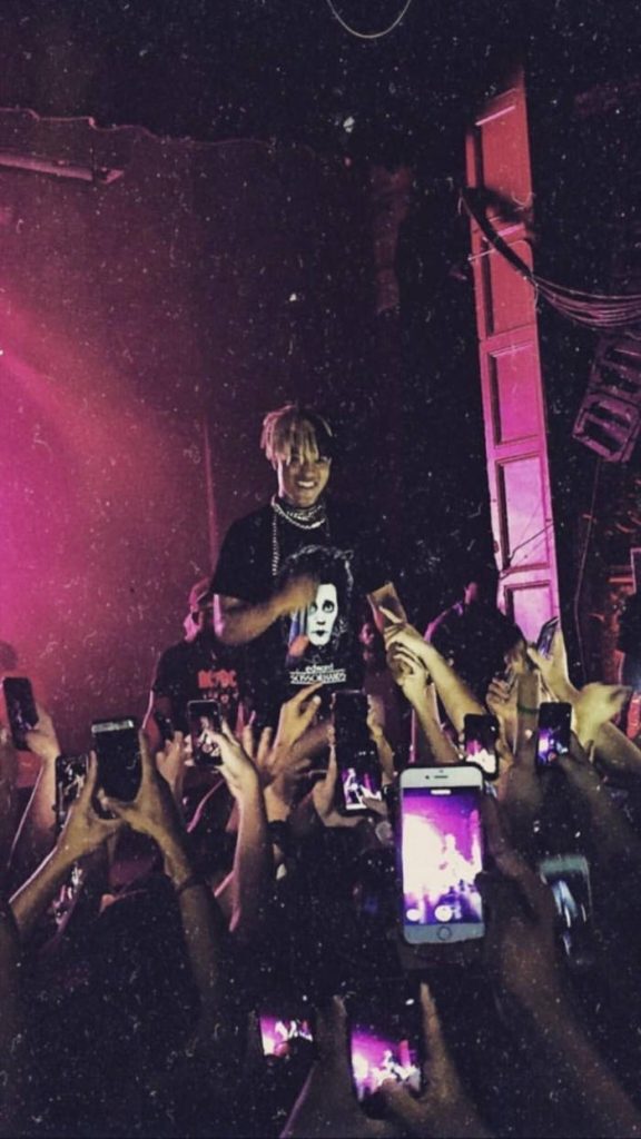 XXXTentacion live concert wallpaper with magenta lighting fans glowing phones lo-fi film style