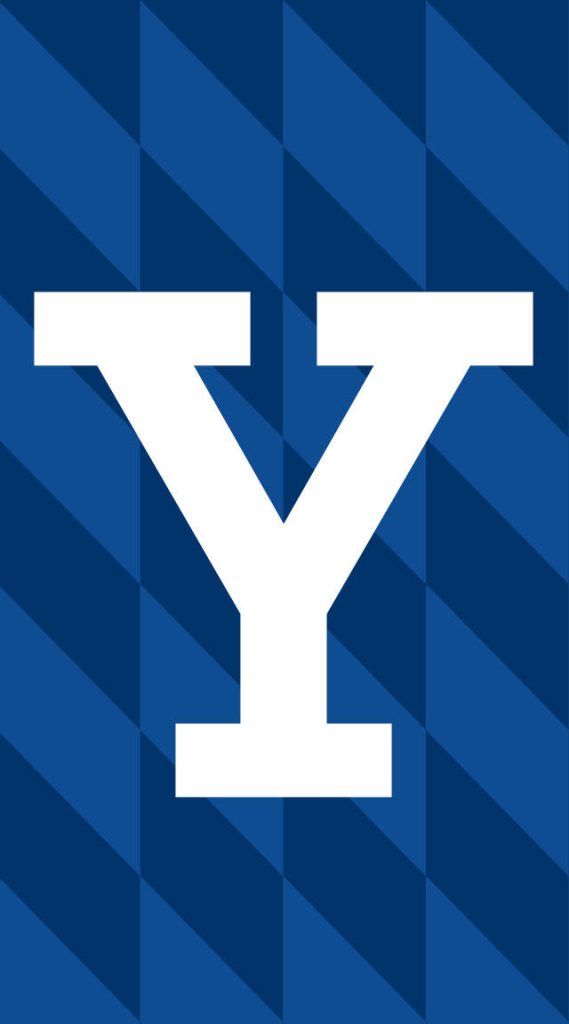 Yale University wallpaper with bold white Y on geometric multi-tonal blue diamond background