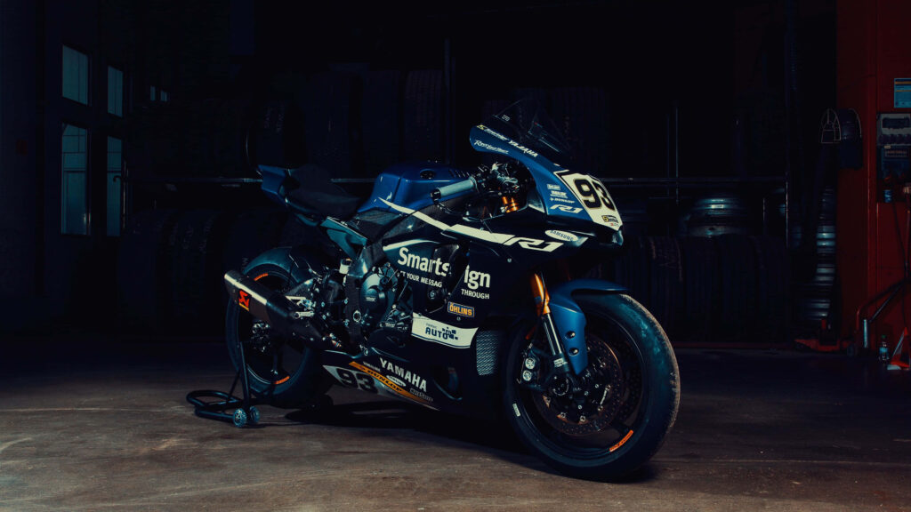 Yamaha Racing Motorcycle Wallpaper: Sleek Design in Dark Ambiance