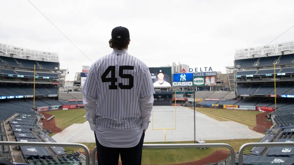 Yankee Stadium wallpaper with figure in Gerrit Cole 45 jersey overlooking empty field Bronx spirit