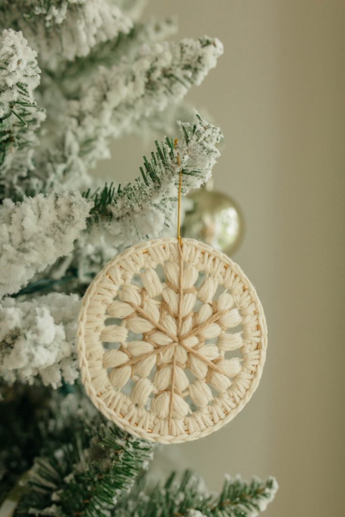 Yarn Ornament on Snowy Tree - Holiday Cheer Wallpaper Background