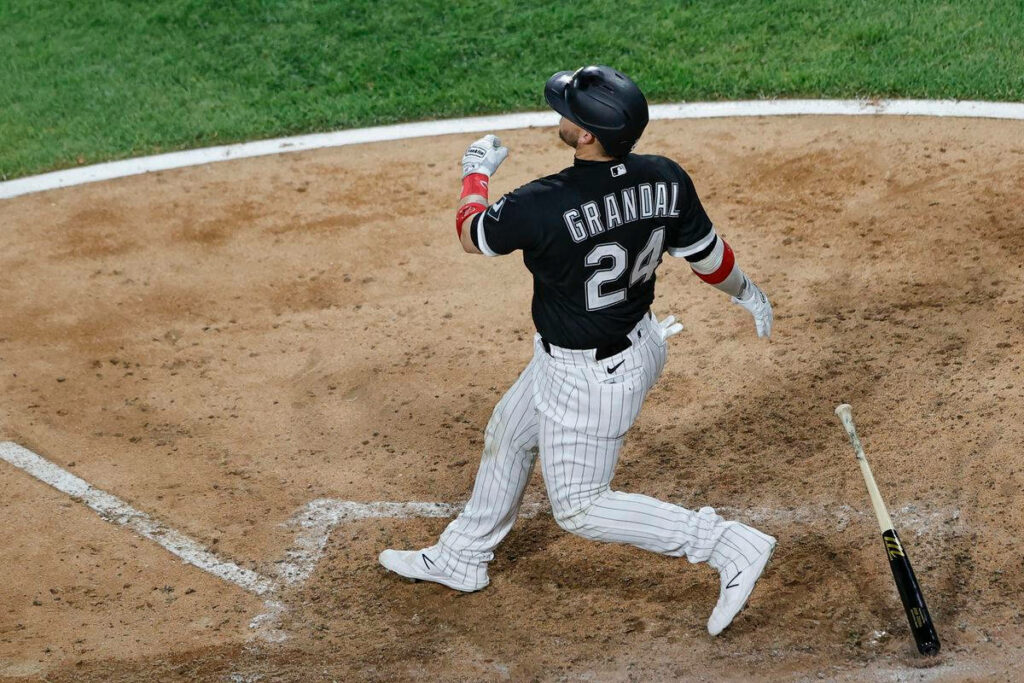 Yasmani Grandal Action Wallpaper: Dynamic Baseball Background Image