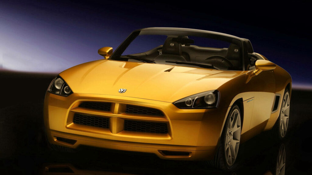 Yellow Dodge Demon front view with aggressive grille and sleek headlights on gradient background Wallpaper