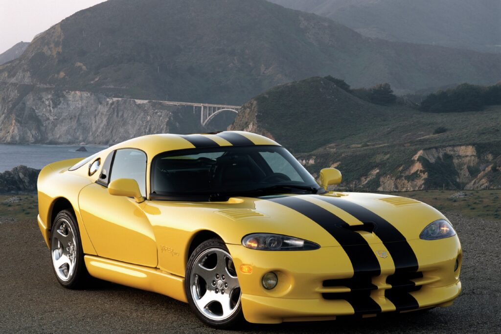 Stunning Yellow Dodge Viper GTS Side View Wallpaper with Scenic Background