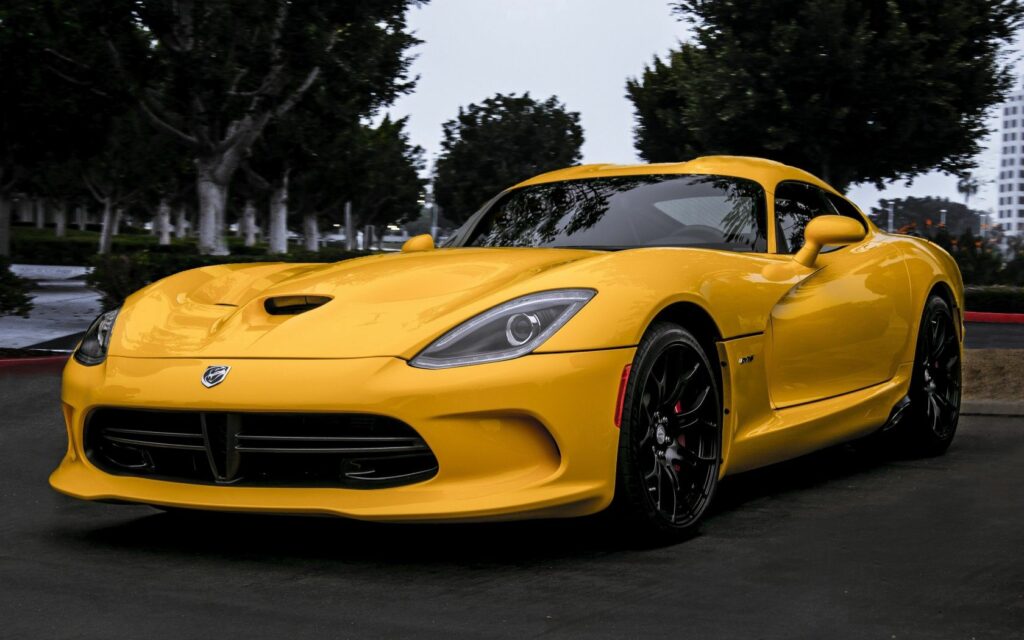 Vibrant Yellow Dodge Viper Wallpaper with Tree Background