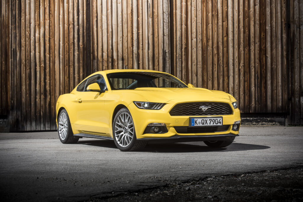Yellow Ford Mustang GT EU-Spec Wallpaper: Sporty Side View Background