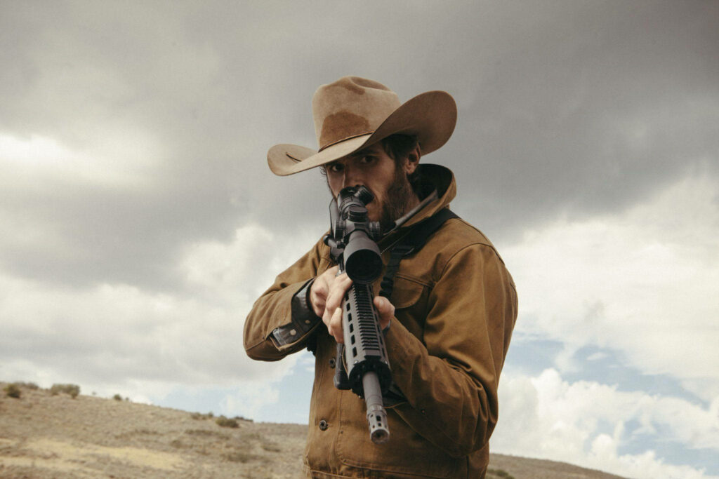 Yellowstone TV Scene: Character Aiming Rifle - Dramatic Wallpaper