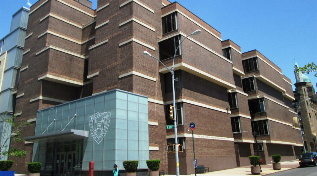 Yeshiva University Library modern building with red brick geometric design and glass accents sky Wallpaper