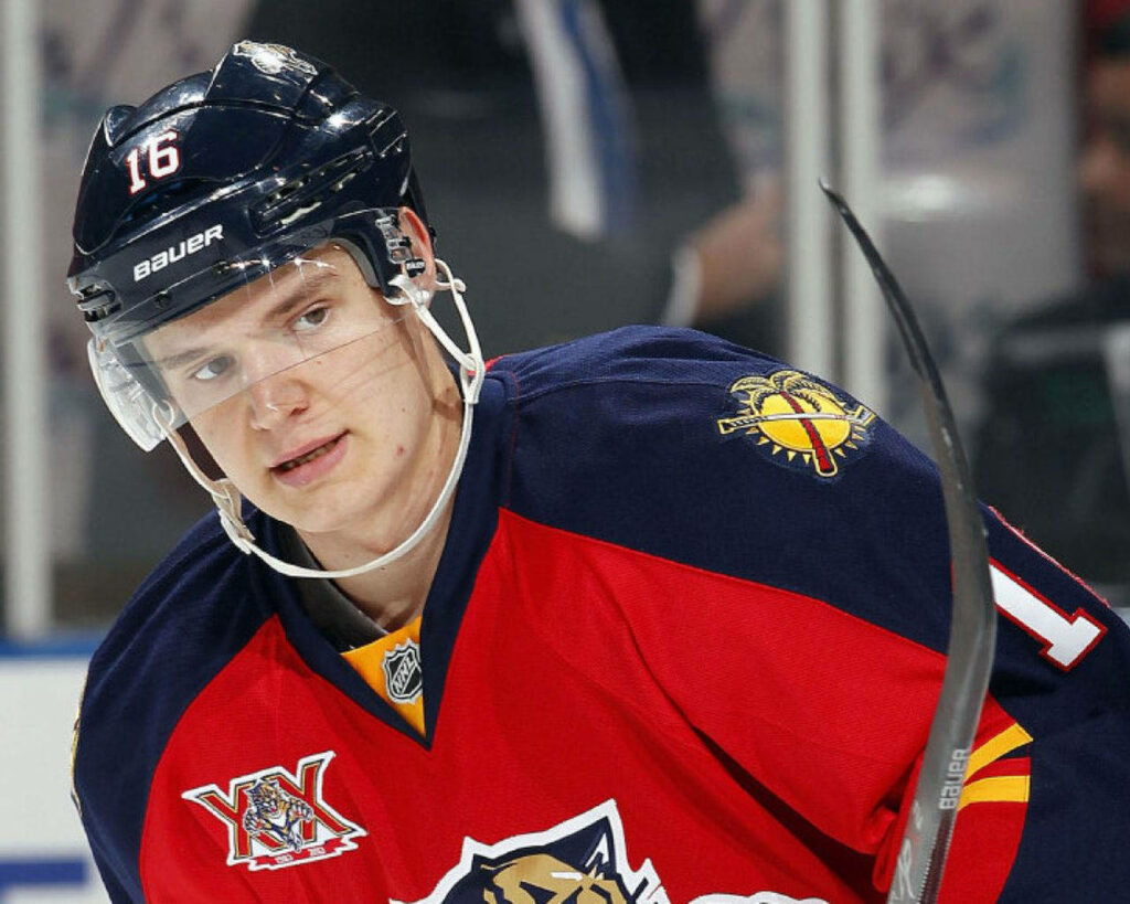 Young Aleksander Barkov in Florida Panthers rookie jersey focused on ice NHL promising career Wallpaper