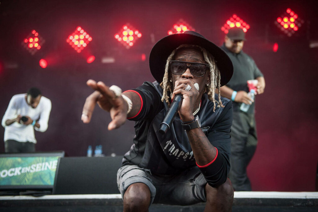 Young Thug's Energetic Live Performance Wallpaper Background