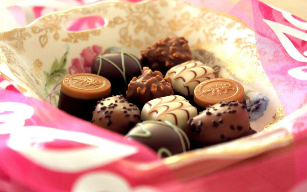Sensational Sweet Treats: Tempting Chocolate Delights Unveiled in Captivating Backdrop Wallpaper
