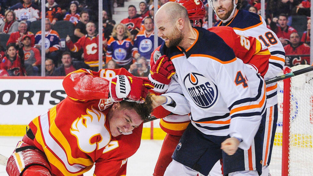 Zack Kassian delivers aggressive hit on Matthew Tkachuk in intense Edmonton Oilers vs Calgary Flames NHL game Wallpaper