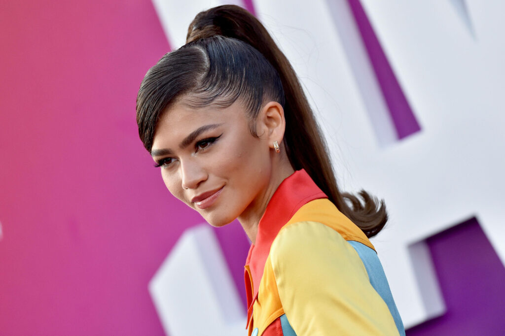 Zendaya stylish outfit Space Jam premiere vibrant colorful backdrop perfect bold wallpaper