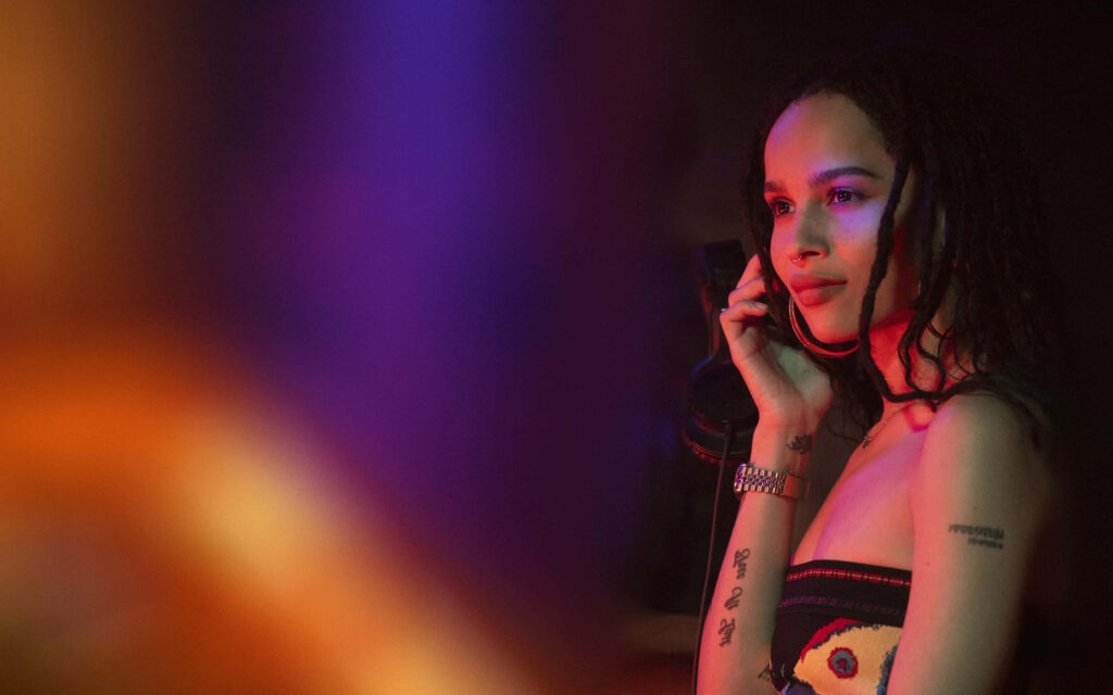 Zoe Kravitz making a phone call with vibrant colorful background stylish modern wallpaper