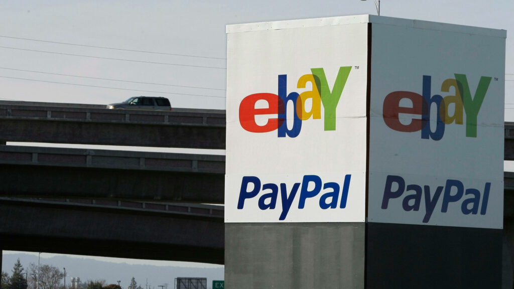 Bright eBay and PayPal logos on urban highway backdrop with passing car online commerce wallpaper
