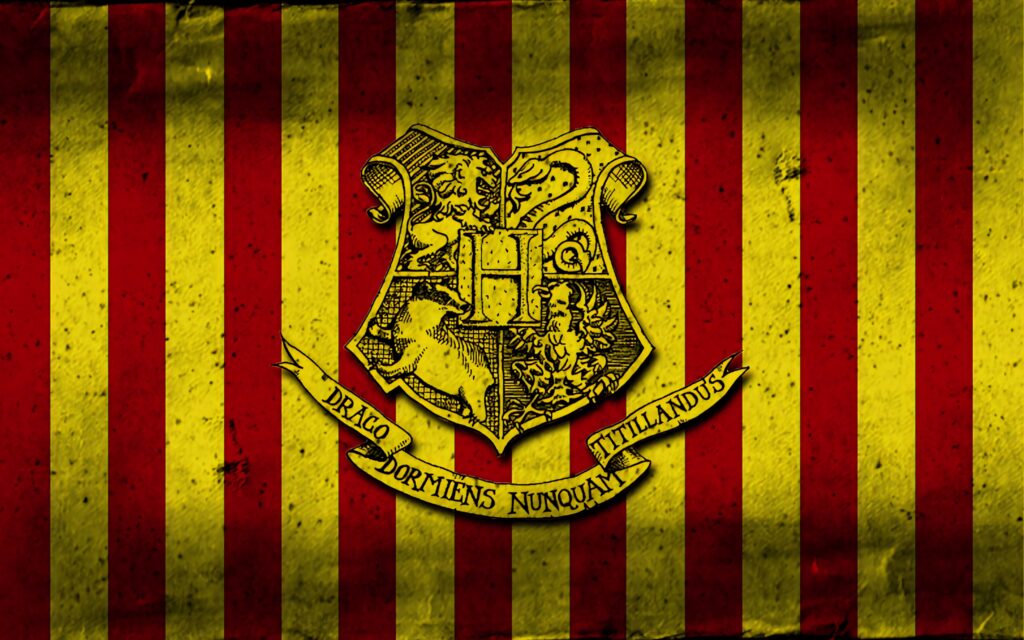 Gryffindor crest on red and gold stripes wallpaper showcasing Hogwarts courageous spirit
