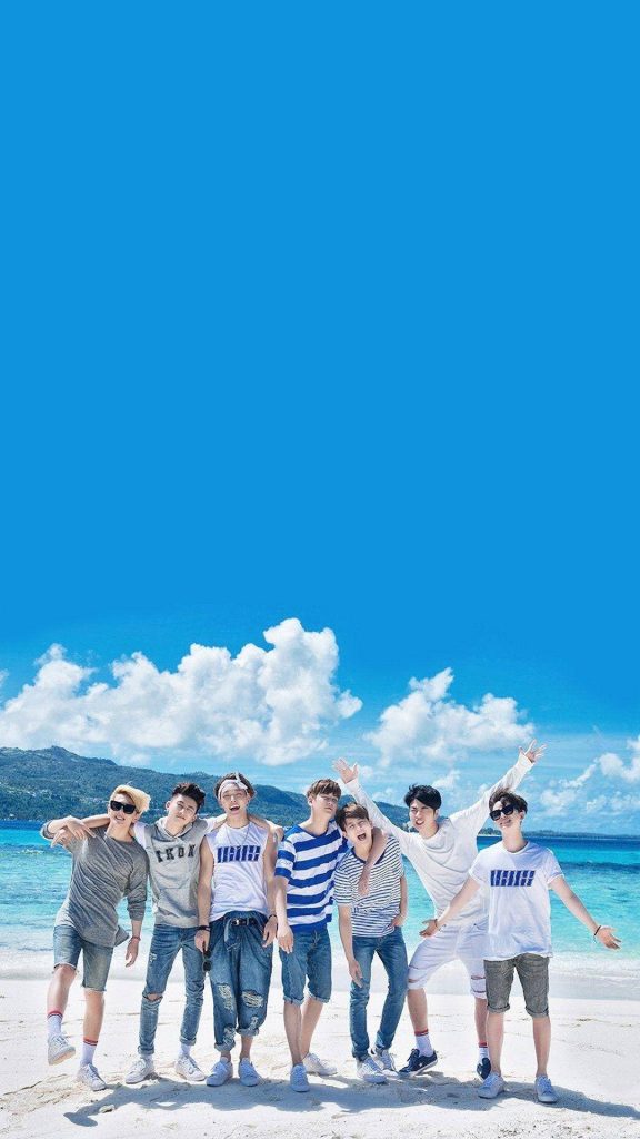 iKON K-pop group on tropical beach summer wallpaper with blue sky white sand and turquoise water