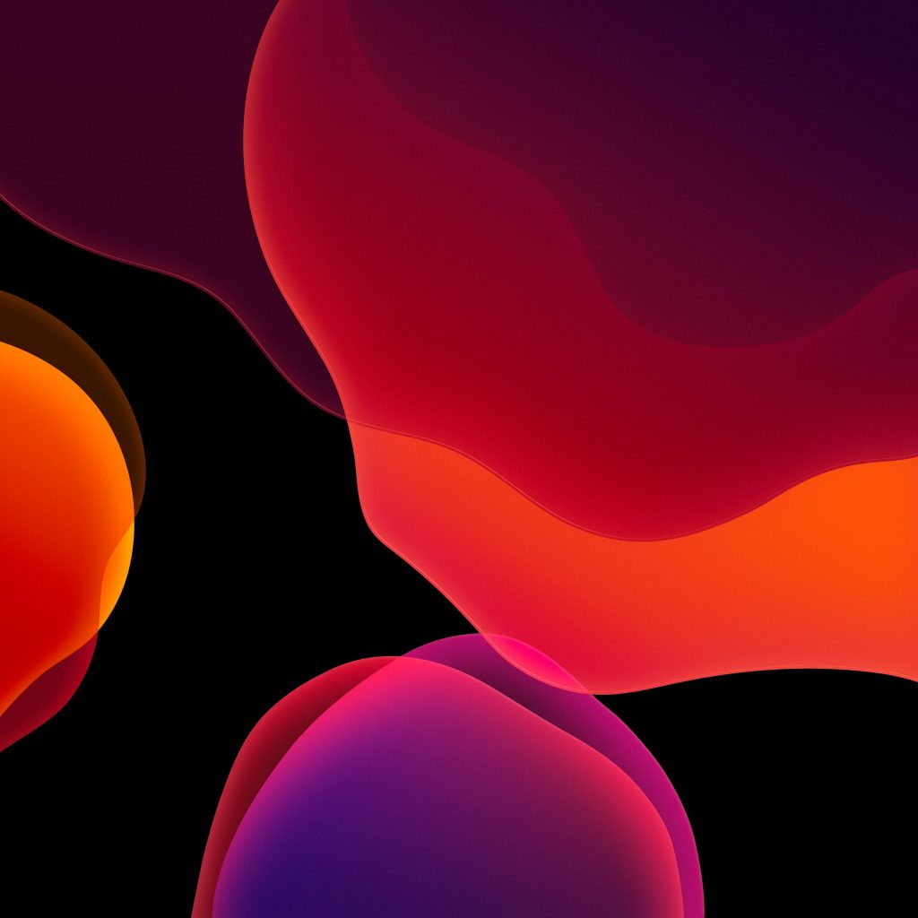 iOS 13 abstract wallpaper with fluid red and purple blobs on black vibrant modern background