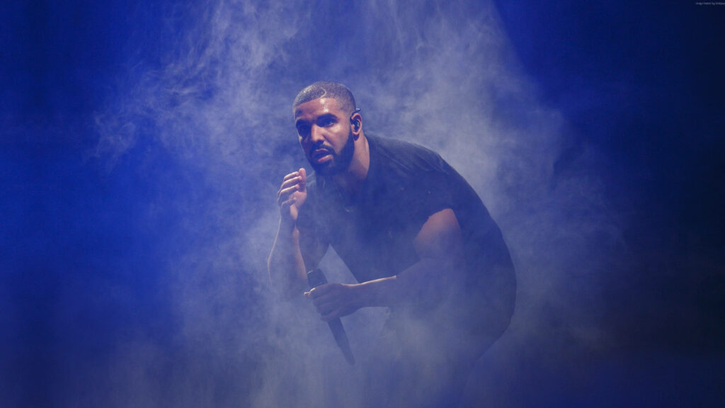 Smoke and Mirrors: Drake's Enthralling Live Performance Wallpaper