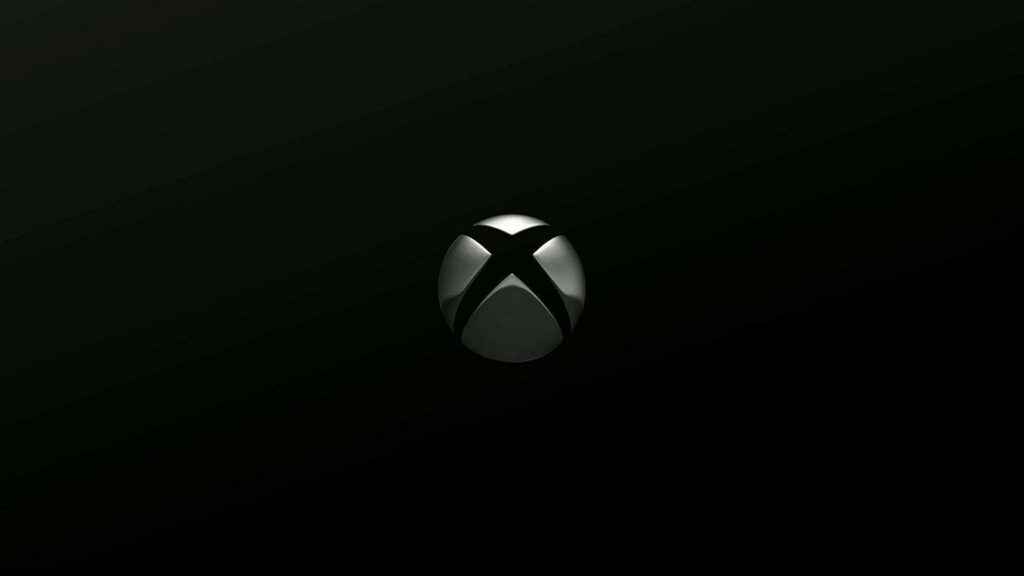 Xbox One X Emblem: Minimalistic Artistry in Sleek Black Backdrop Wallpaper